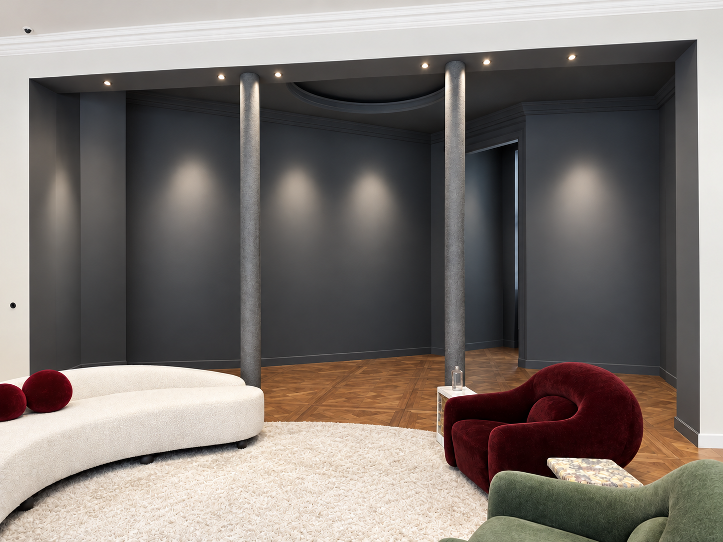 The spacious back room with its curved sofas, columns and marble fireplace, without artworks