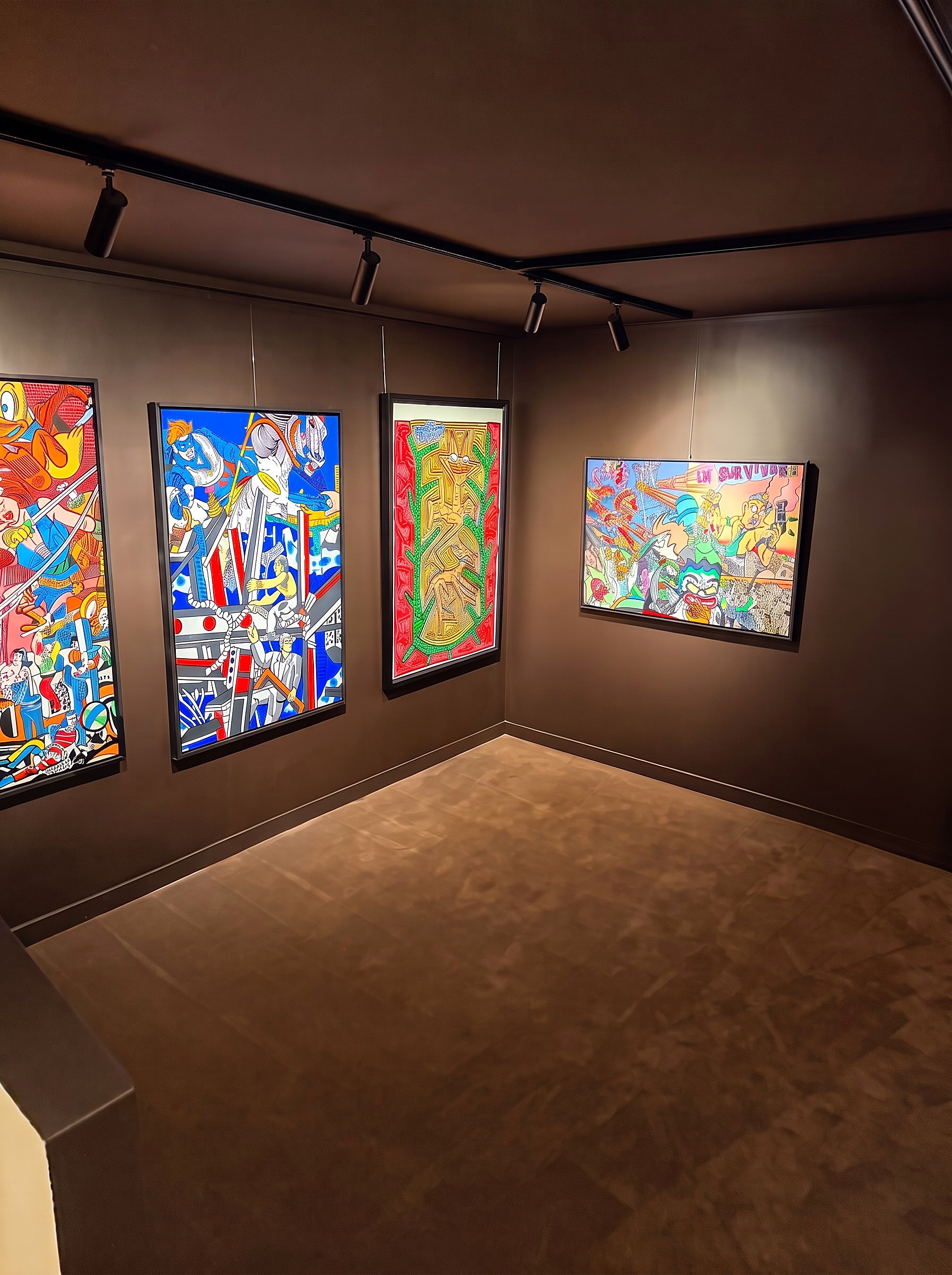 The lower-level exhibition space, with artworks